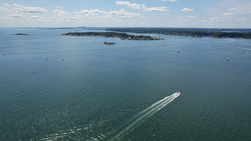 Aerial view of speedboat wake on blue ocean water