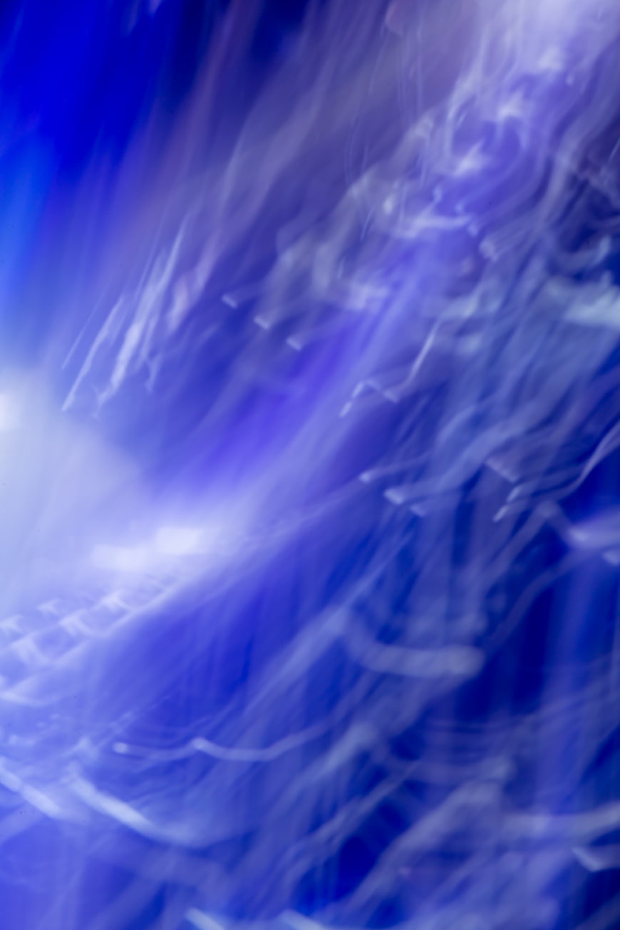 Abstract Blue and Purple Light Waves Background