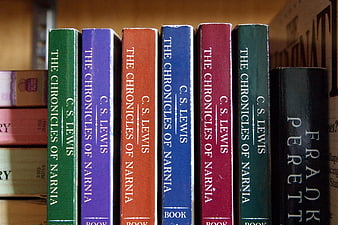 Colorful Chronicles of Narnia Book Spines on Shelf