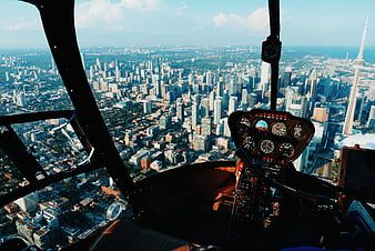 Helicopter cockpit view of Toronto skyline with CN Tower