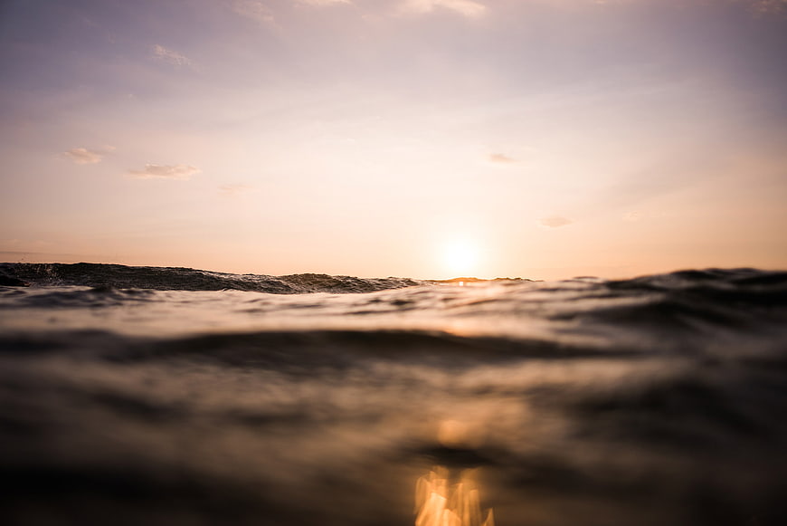Ocean Waves at Sunset with Shallow Depth of Field