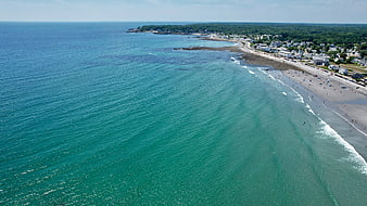 Aerial View of Turquoise Ocean and Sandy Beach Coastline