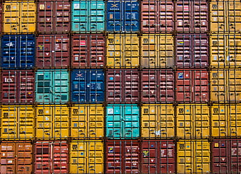Colorful stacked shipping containers at cargo port