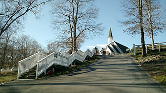White Chapel on Hill with Zigzag Stairs and Bare Trees