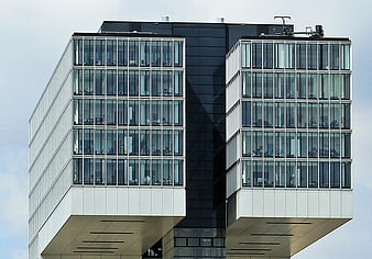 Modern office building with glass facade and geometric architecture
