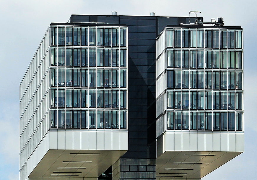 Modern office building with glass facade and geometric architecture