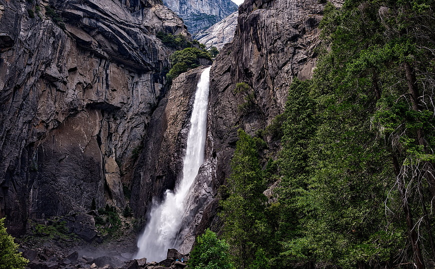 Majestic Yosemite Waterfall Cascading Down Granite Cliffs