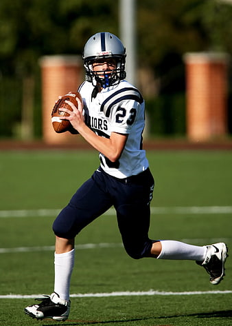 American Football Player Running with Ball on Field