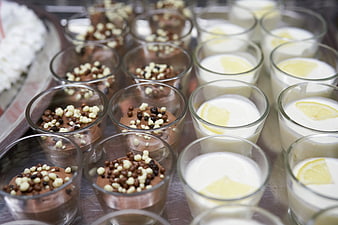 Assorted chocolate and lemon desserts in glass cups