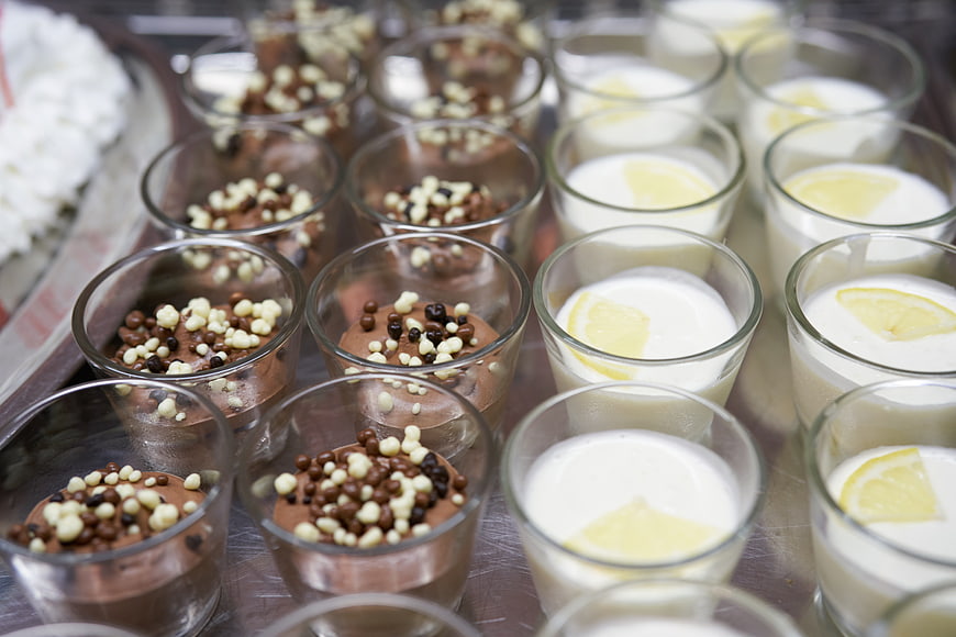 Assorted chocolate and lemon desserts in glass cups