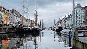 Colorful Copenhagen Canal with Historic Boats and Buildings