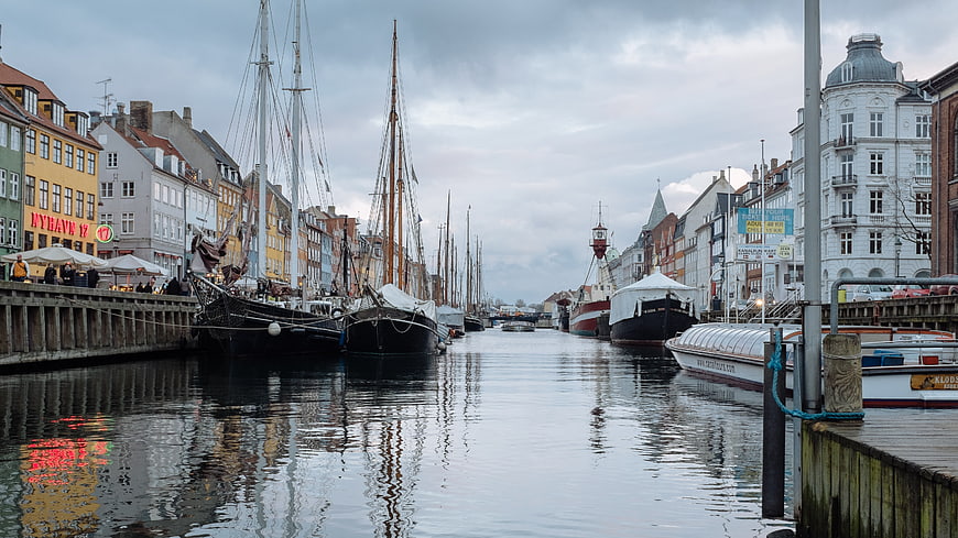 Colorful Copenhagen Canal with Historic Boats and Buildings