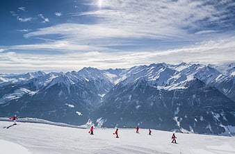 Skiing Lessons on Alpine Slope with Snowy Mountain Panorama