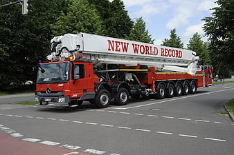 Red Mercedes Fire Truck with World Record Crane on Road