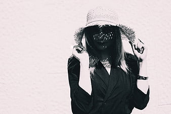 Woman in Hat with Dappled Shadows on Face