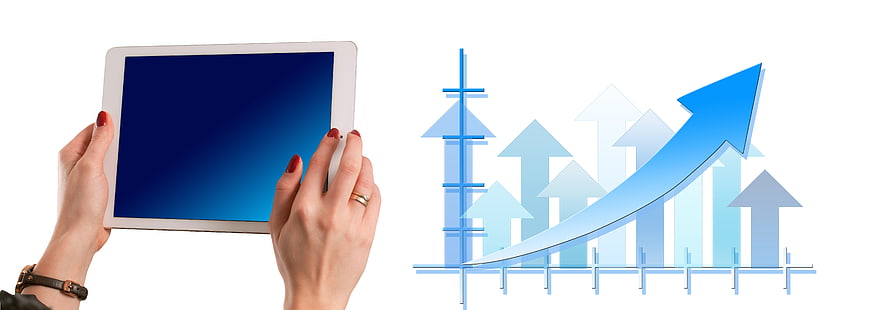 Hands holding tablet with blue screen and business growth chart