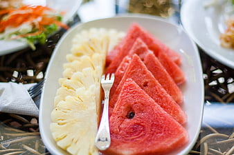Sliced Watermelon and Pineapple on White Plate