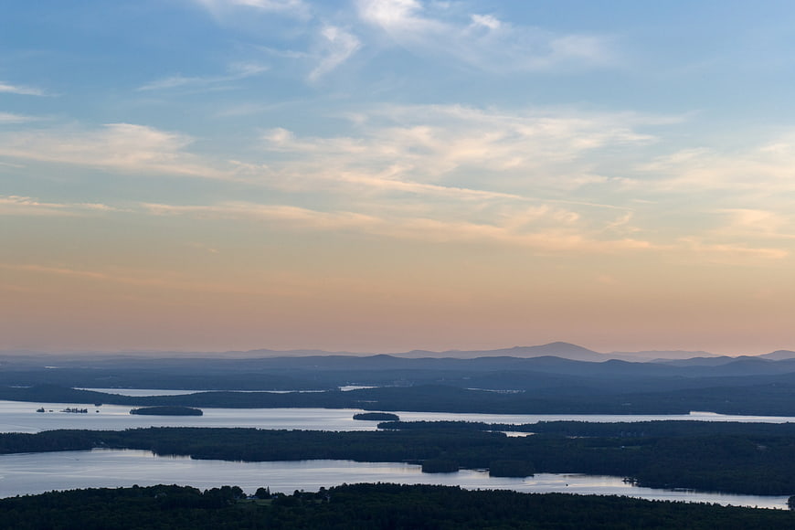 Scenic Lake Landscape with Forested Islands at Sunset