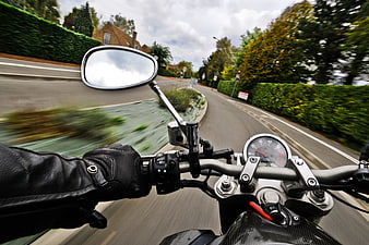 First-person view of motorcycle riding on a winding road