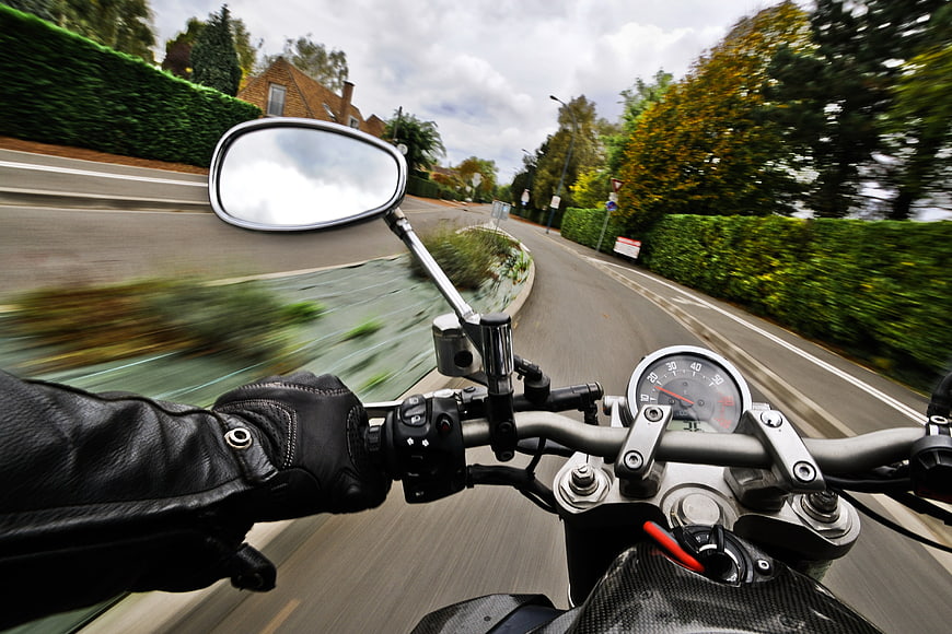 First-person view of motorcycle riding on a winding road