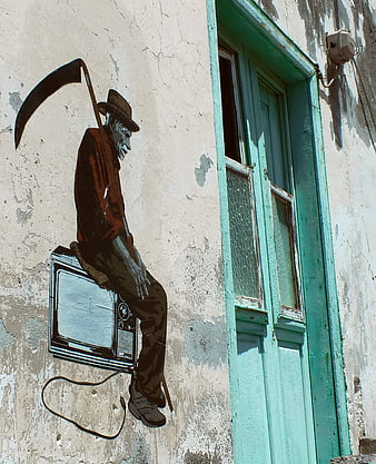 Street art of grim reaper sitting on vintage television