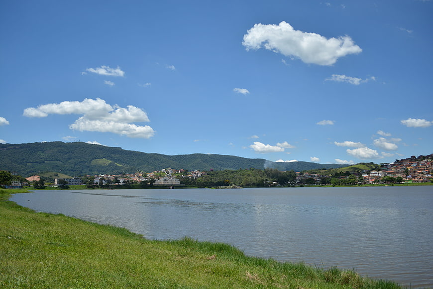Scenic Lake View with Green Hills and Blue Sky