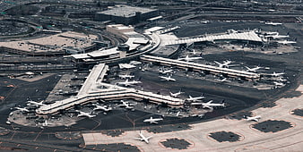 Aerial View of Busy International Airport Terminal and Runway