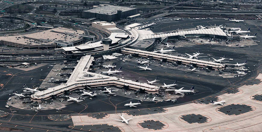 Aerial View of Busy International Airport Terminal and Runway