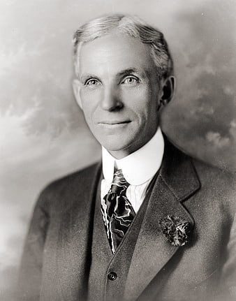 Vintage black and white portrait of Henry Ford in a suit