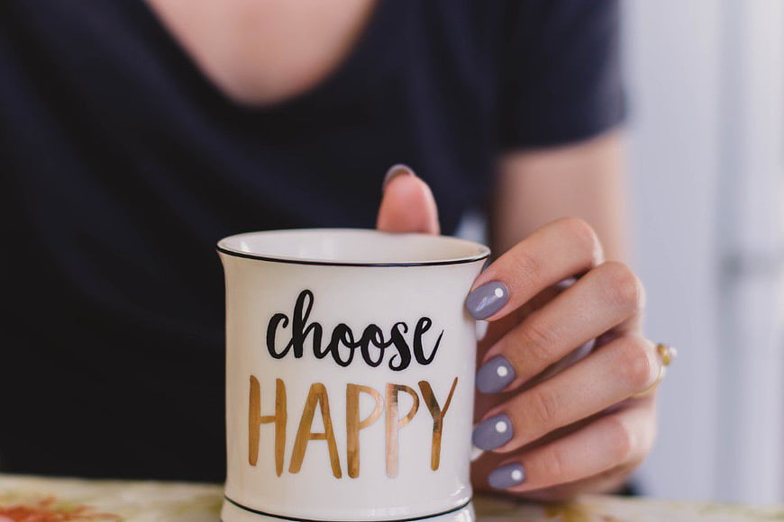 Woman Holding Choose Happy Coffee Mug