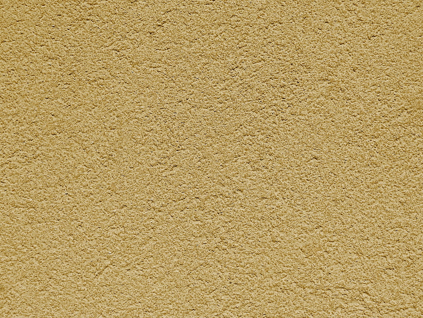 Textured beige stucco wall background