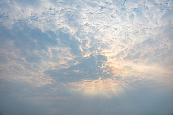 Sunbeams Breaking Through Textured Altocumulus Clouds