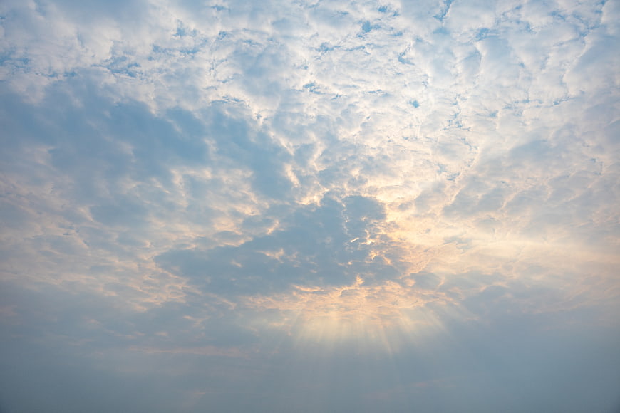 Sunbeams Breaking Through Textured Altocumulus Clouds