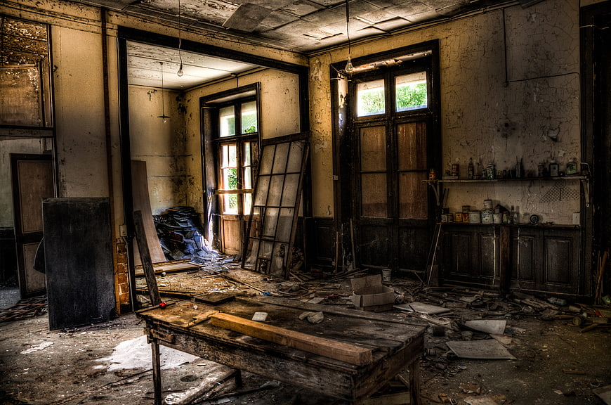 Abandoned Dilapidated Interior Room with Debris and Decay