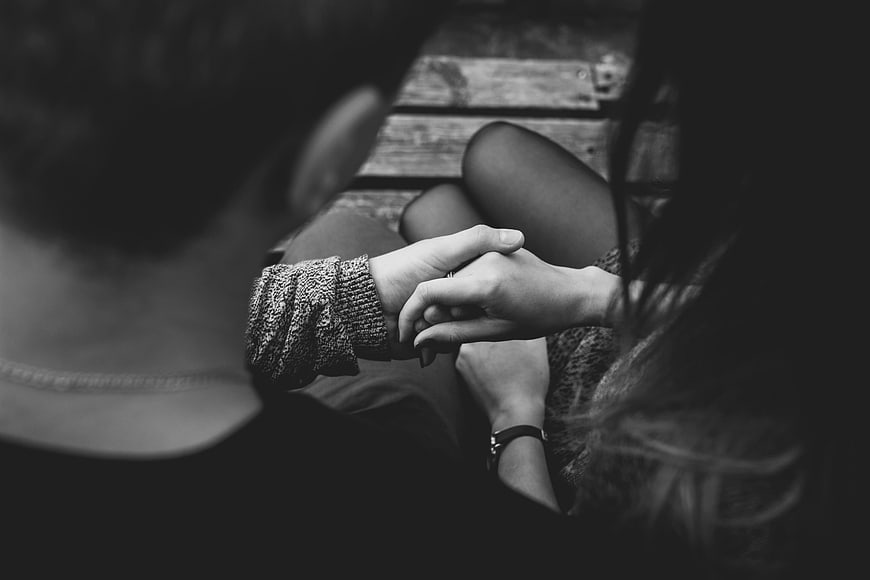 Black and White Close-up of Couple Holding Hands