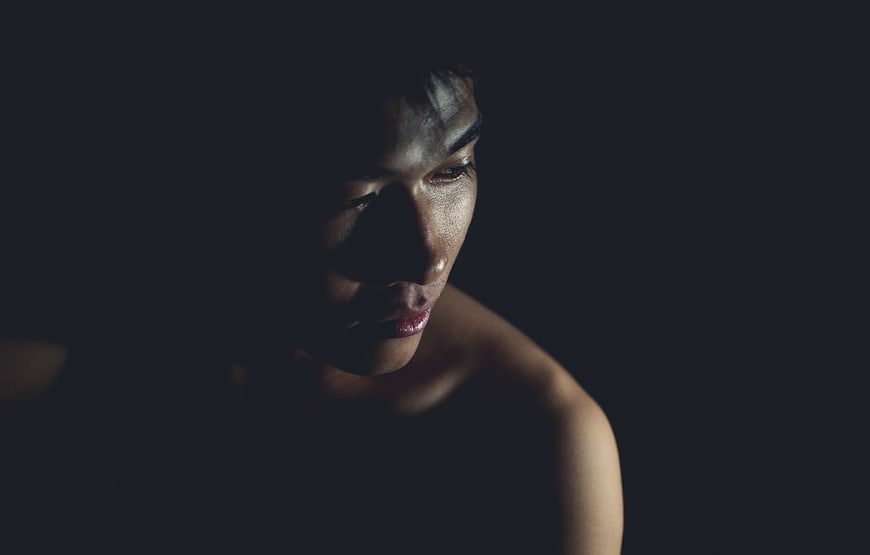 Dramatic Low-Key Portrait of Asian Woman in Profile