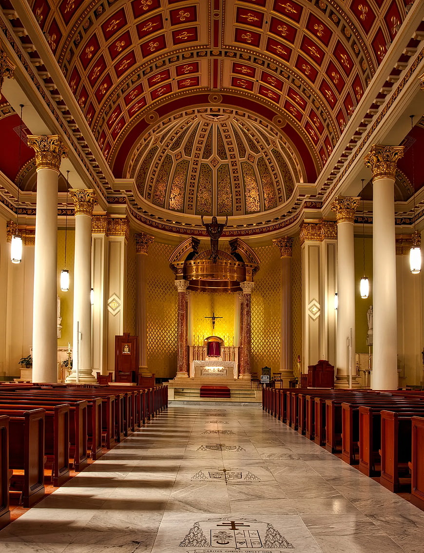 Grand Cathedral Interior with Ornate Dome and Pews