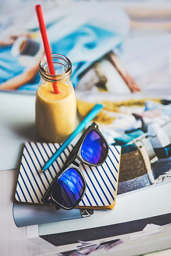 Summer travel accessories with sunglasses and smoothie