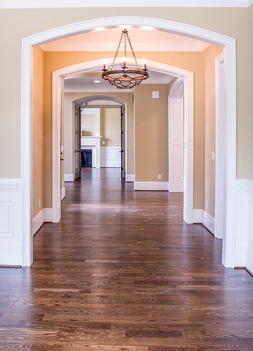 Elegant Home Interior With Arched Doorways And Hardwood Floors