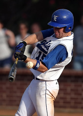 Baseball Player Swinging Bat in Blue and White Uniform