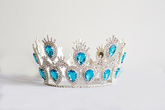 Silver Tiara with Blue Gems on White Background