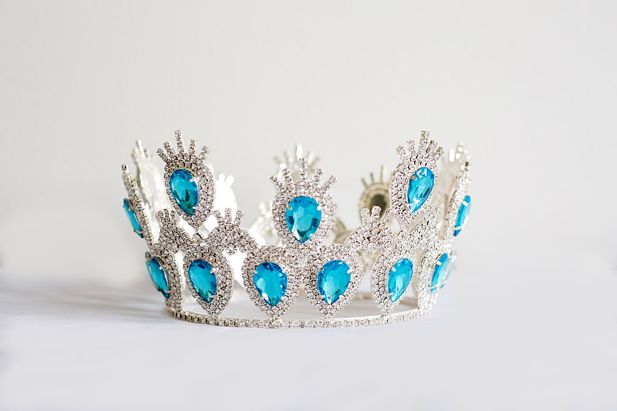 Silver Tiara with Blue Gems on White Background