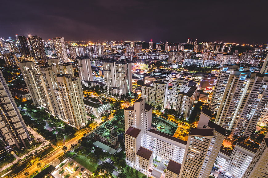 Aerial Night View of Singapore Cityscape with Illuminated High-Rise Buildings