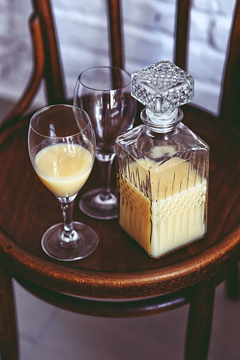 Banana juice in vintage glass decanter and coupe glasses