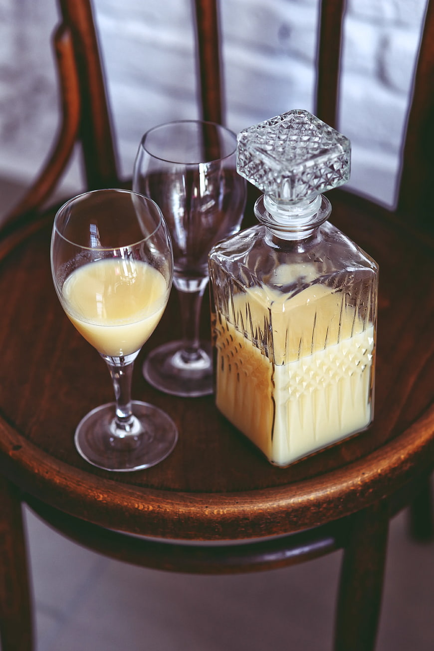 Banana juice in vintage glass decanter and coupe glasses