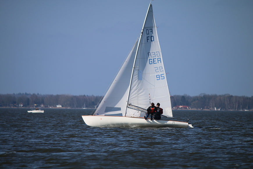 Sailboat with Two Crew Members Sailing on a Lake