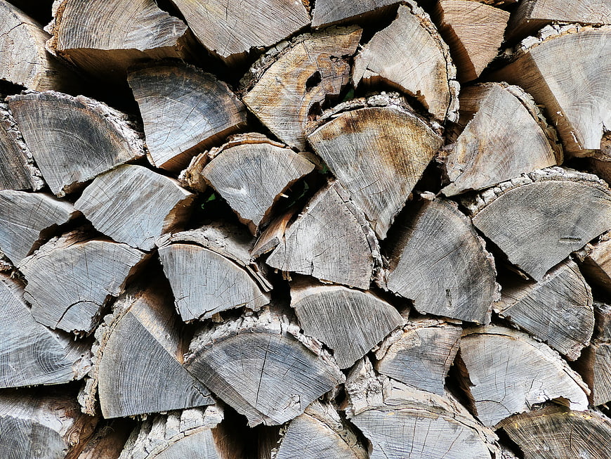 Stacked Firewood Logs Texture Background