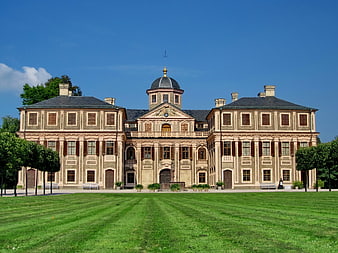 Grand Baroque Palace with Green Lawn and Blue Sky