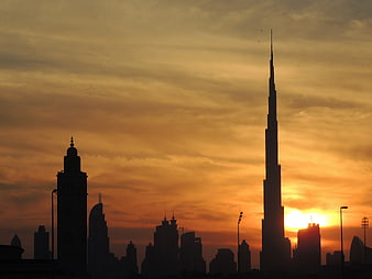 Dubai Skyline Silhouette Featuring Burj Khalifa At Sunset