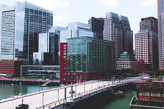 Modern city skyline with bridge and waterfront buildings
